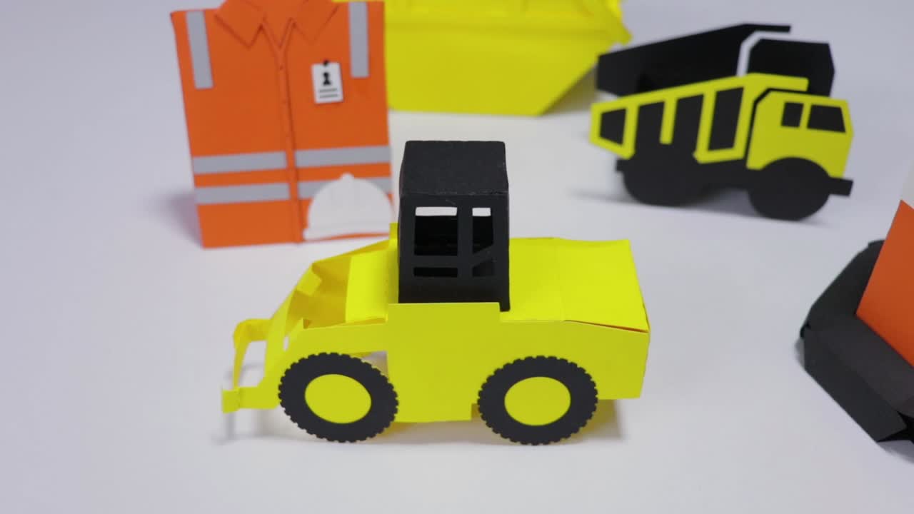 Collection of cardboard construction tools displayed against a white backdrop