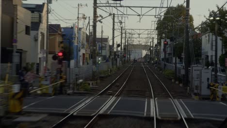 train passing through residential area in japan