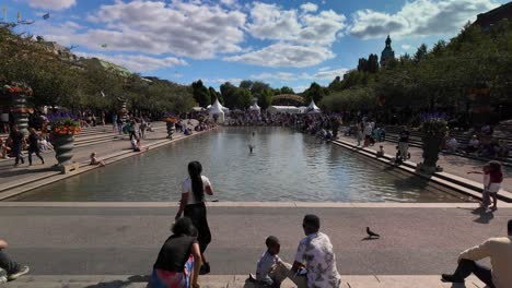 people relax in famous park kungstradgarden in stockholm, sweden. slow motion shot