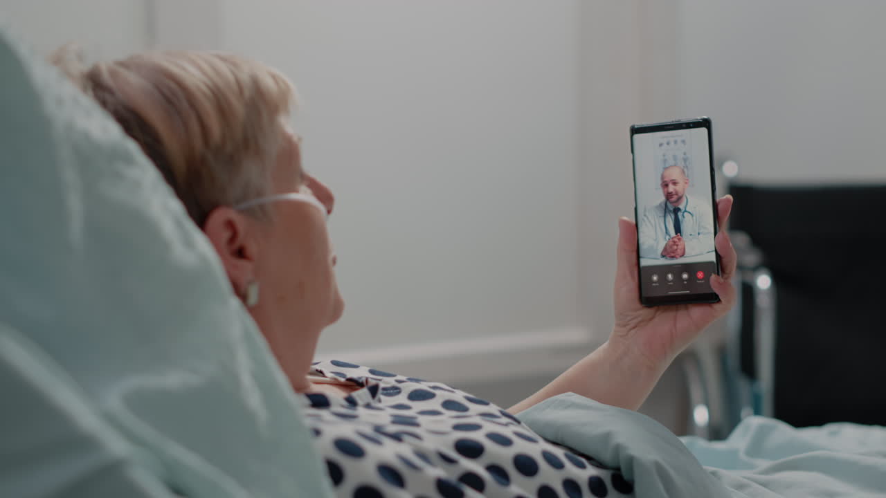 Retired woman talking to doctor on online video call
