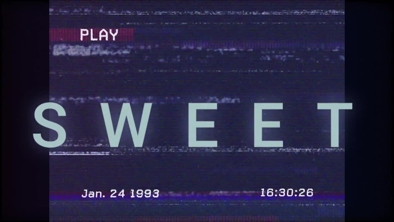 Play icon appearing causing glitch drifting behind SWEET title, timestamp ticking giving tape vibe