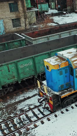 industrial conceptual scene with trains. aerial view of freight train on the railway station. vertical video