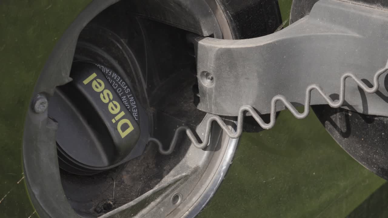 Diesel Fuel Cap on SUV Car for Filling Up Vehicle to Power Engine. Visual Concept for Rising Oil and Energy Prices. UK 4K