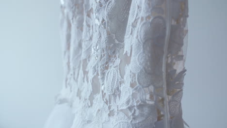close-up of a white lace wedding dress