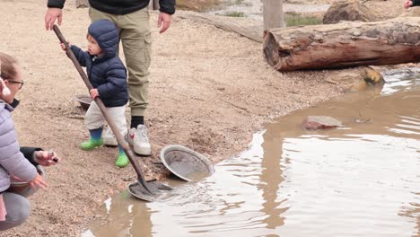 children panning for gold in a river