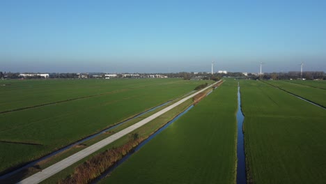 bicycle path route zoeterwoude, lush green grass, wind industry location