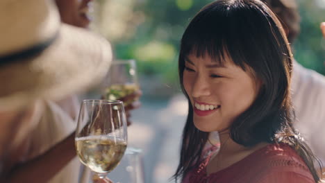 beautiful asian woman dancing with friends at summer dance party drinking wine making toast enjoying summertime social gathering having fun celebrating on sunny day 4k footage