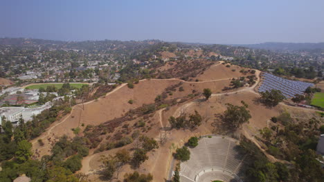 Slow-pull-away-from-hills-with-trail-in-Eagle-Rock-near-Occidental-college-campus-in-Los-Angeles,-California