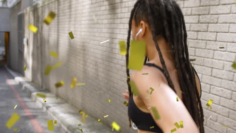 Walking-down-alley,-person-with-dreadlocks-surrounded-by-gold-confetti-animation