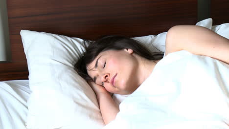 tired woman relaxing in a bed