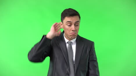 doubting man in formal suit shrugging shoulders