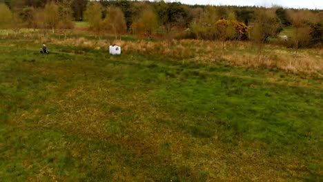 boy riding a bike in the green field 4k
