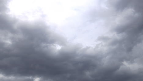 Fast-moving-gray-clouds-cover-the-sky-with-white-clouds