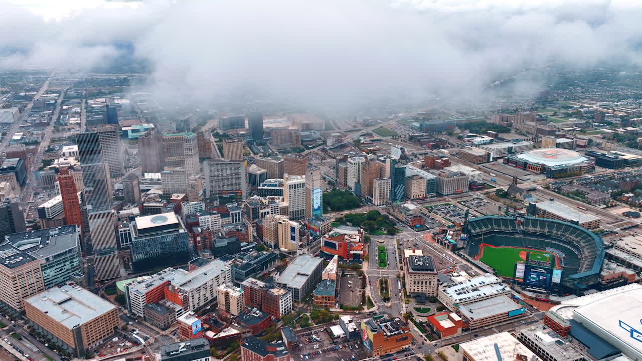 Detroit, USA, 28 July 2025: Clouds float over the vast scenery of Detroit midtown, Michigan, USA. Drone footage distancing from the city downtown with a stadium