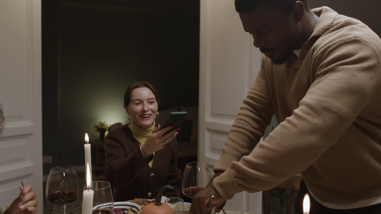 Friends celebrating Thanksgiving at a dinner party