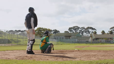 multiracial female baseball players and male umpire, hitting the ball and running on a pitch