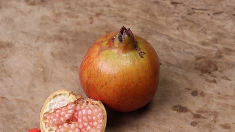 pomegranates on a wooden background