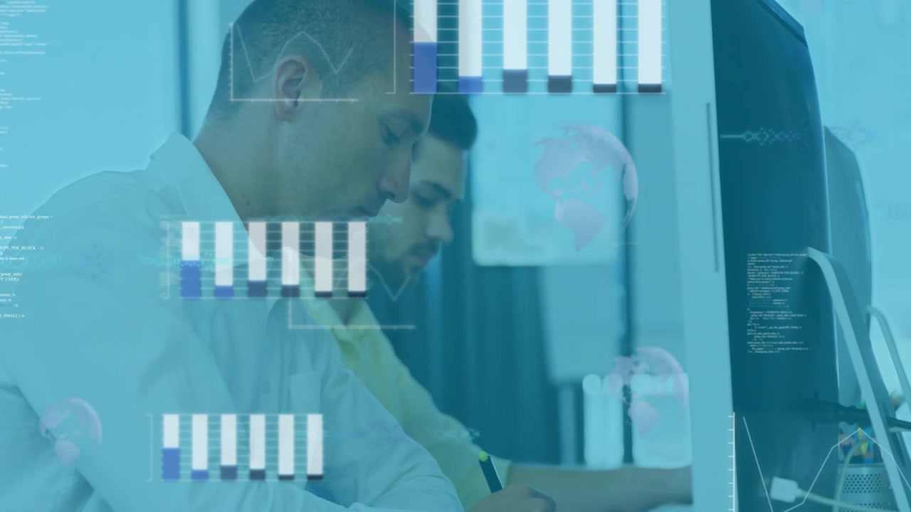 Two Men Working on Computers in Office with Digital Data Overlay