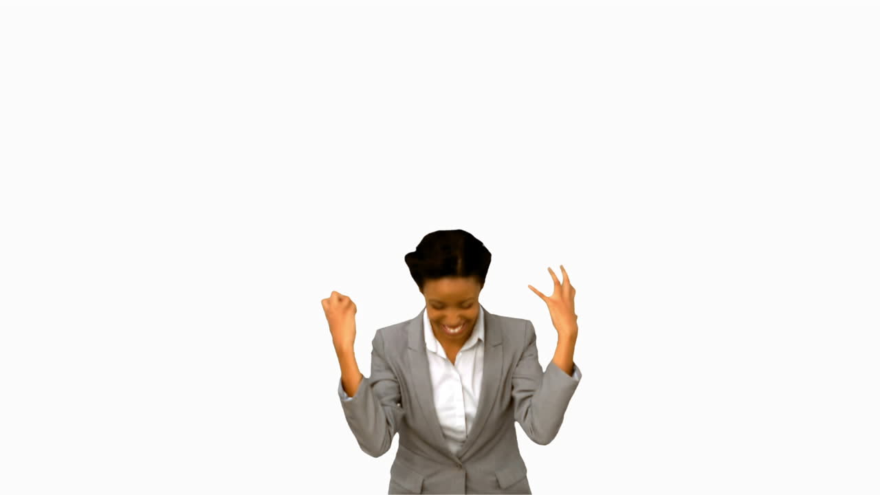 Pretty businesswoman raising arms on white screen