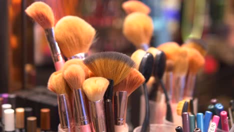 closeup of makeup brushes in a holder