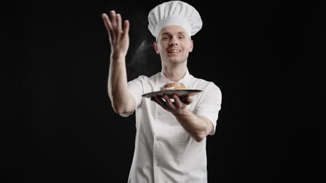 chef presenting a cinnamon roll