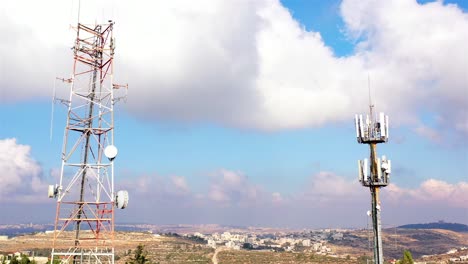 telecommunication towers over a cityscape