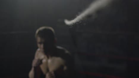 boxer training in the ring at night