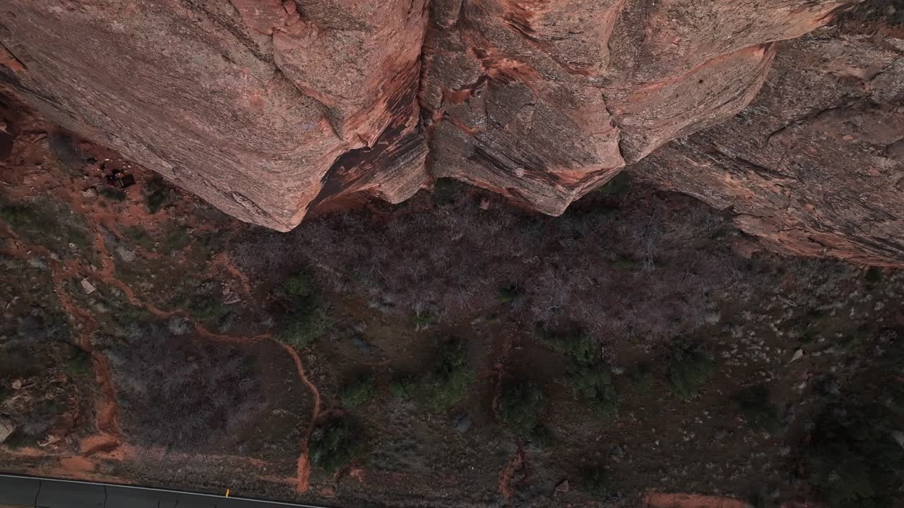 High aerial top shot ascend perspective of Moab stunning desert landscape, capturing immense geological formations