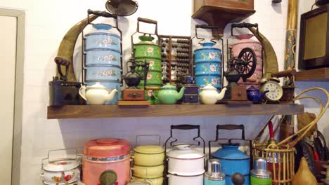 Detail of antique objects in a store. Pan right