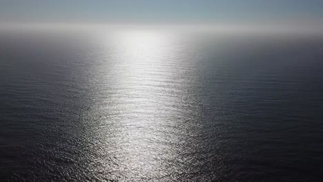 Aerial-Shot-Of-Ocean-in-suns-reflection