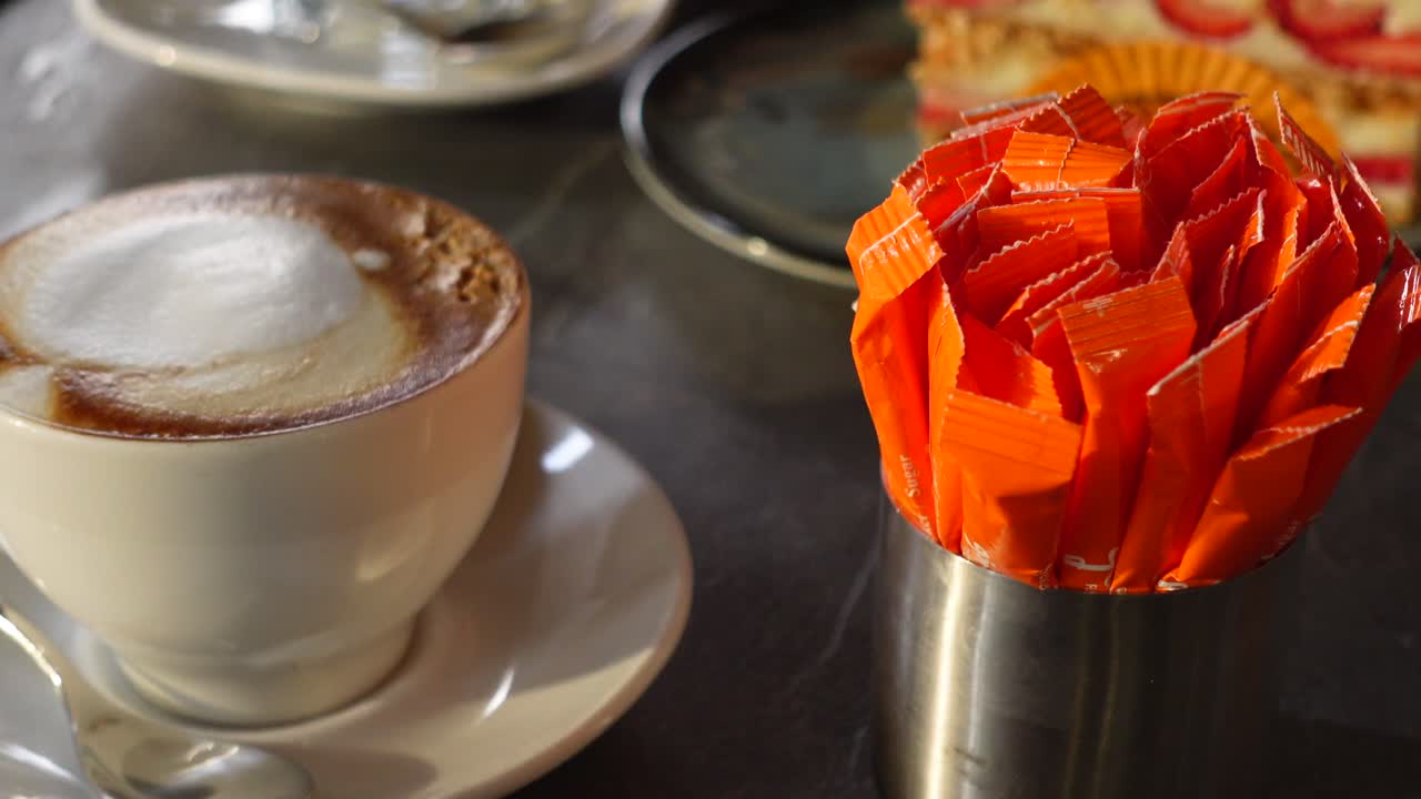 Cappuccino and Dessert at a Cafe