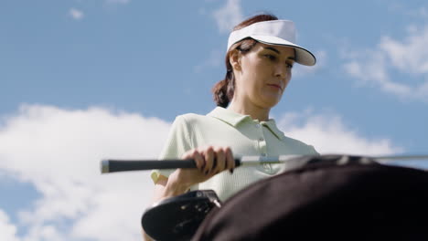 caucasian woman on the golf course.