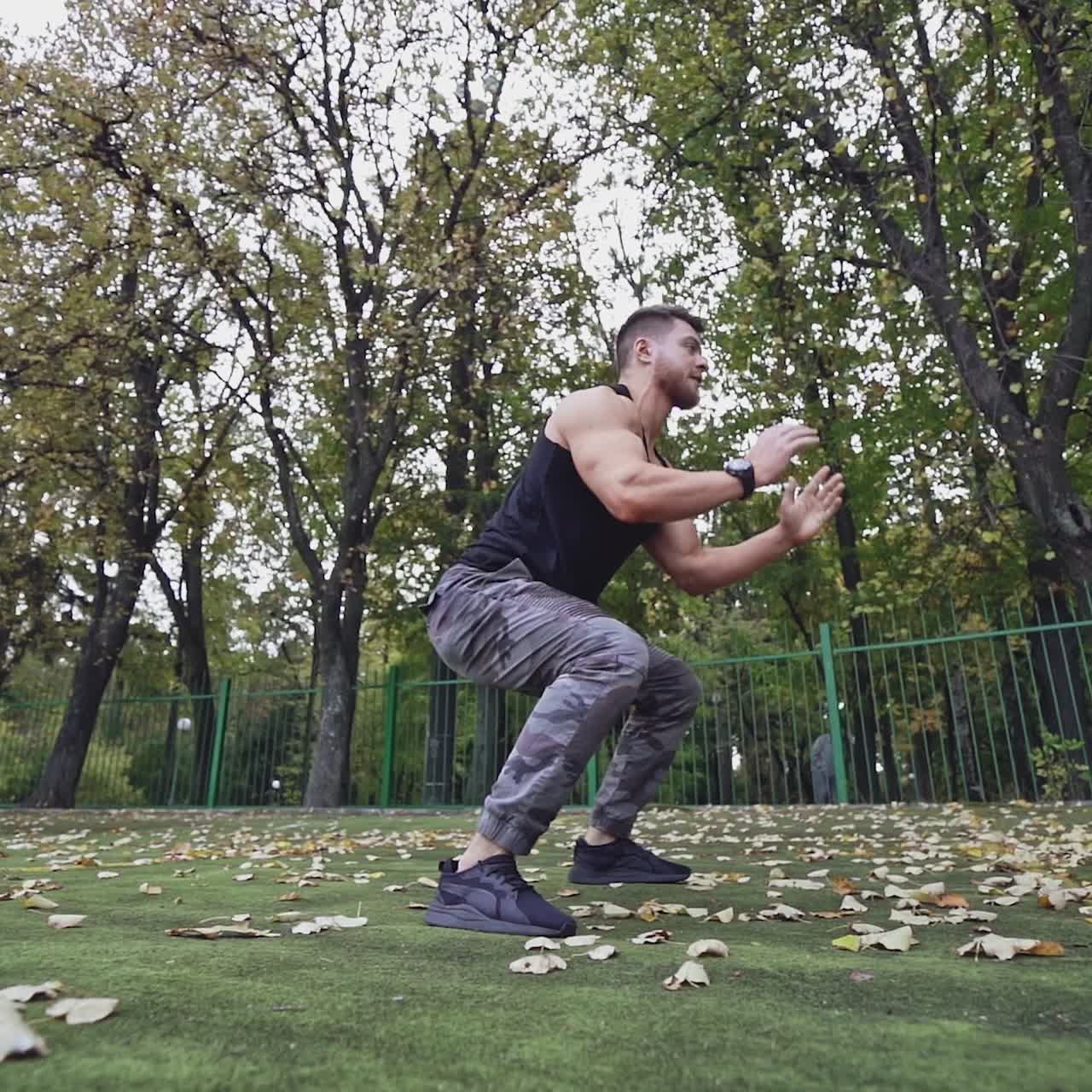 . Athletic male training outdoor. Man doing strength training exercise pushup outdoor