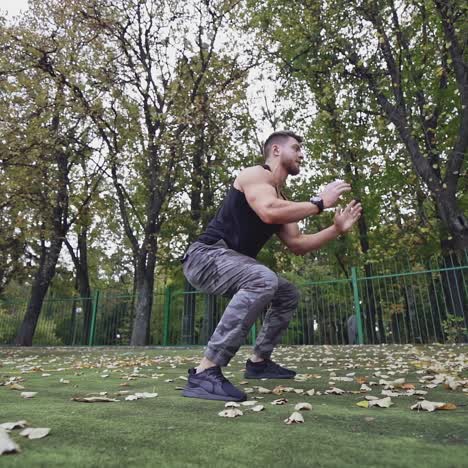. athletic male training outdoor. man doing strength training exercise pushup outdoor
