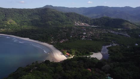 Aerial-view-down-from-mountains-towards-the-Barro-da-Sahy-town,-in-sunny-Brazil