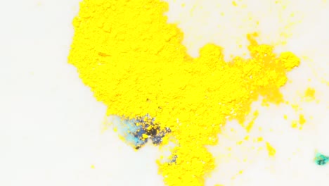 yellow and blue paint splashes on white background