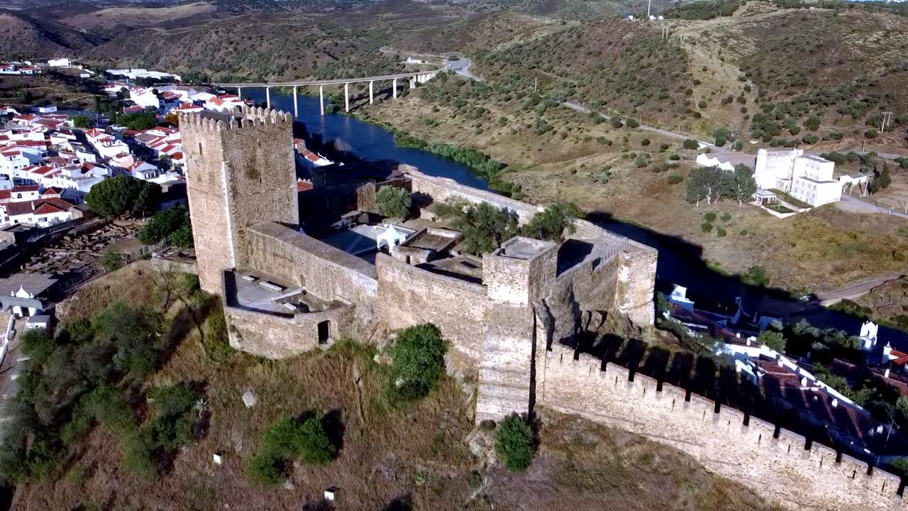 Slow Motion Aerial View of Alentejo - Portugal: Mertola Castle's Grandeur Shines Under the Summer Sun's Embrace