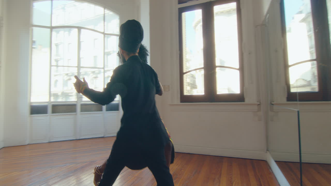 Couple in Stage Costumes Dancing Argentine Tango in Studio