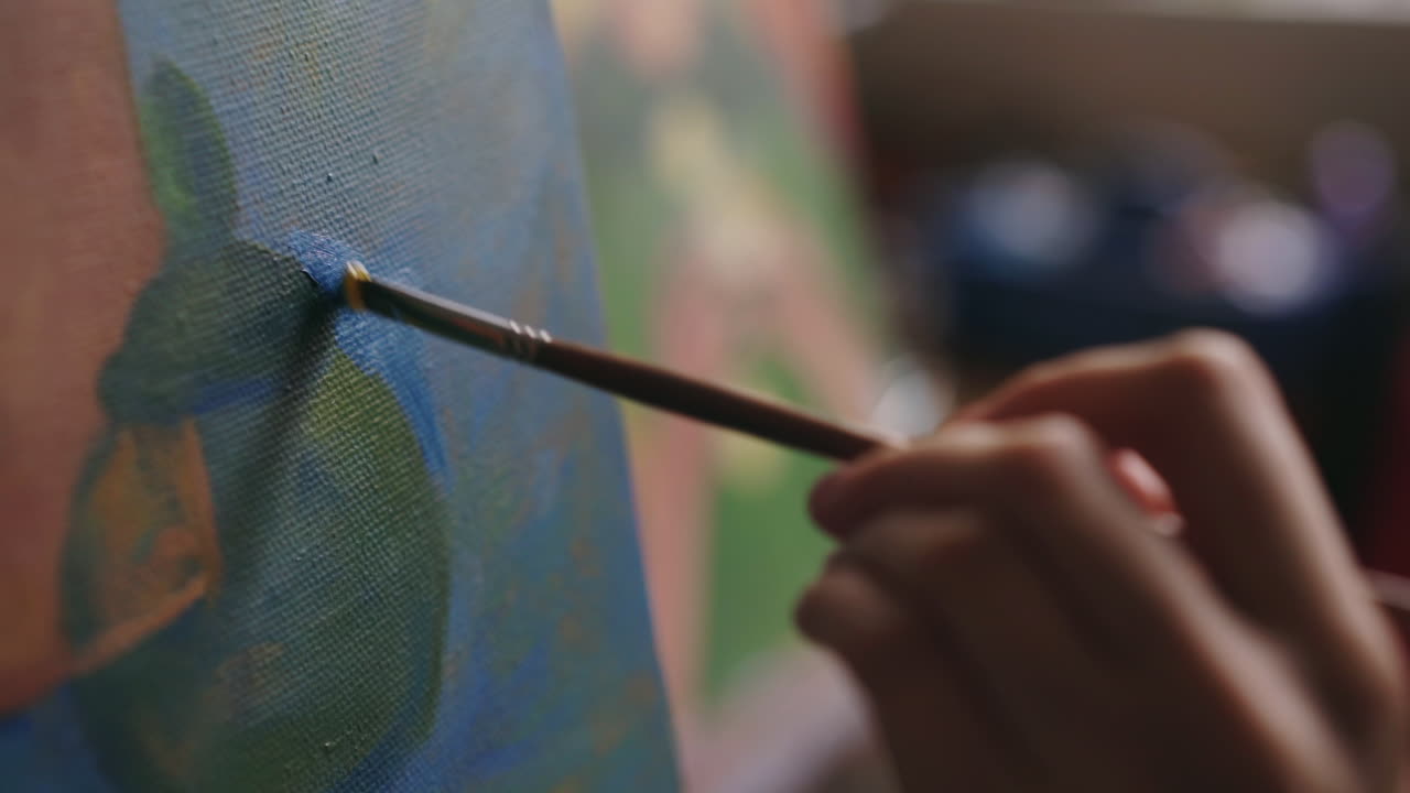 Closeup of an artist painting a picture