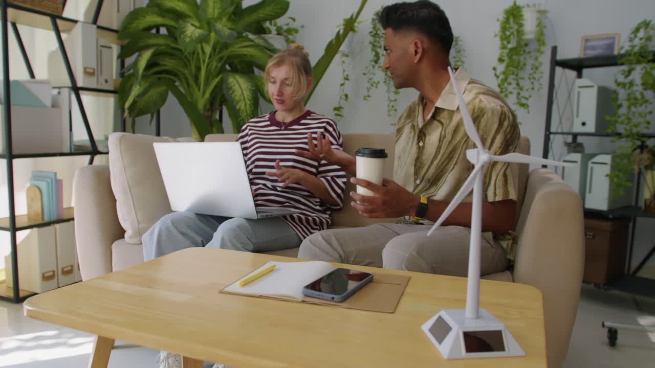 Biracial Coworkers Meeting at Office of Alternative Energy