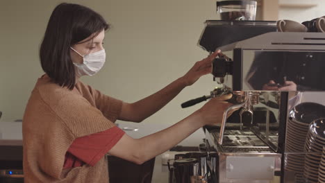 female barista working in coffeeshop