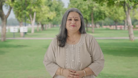 Happy-and-cheerful-Indian-old-woman-smiling-in-park