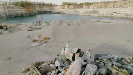 piles of debris and sands on the ground in an open mining site near hickory creek in arkansas, usa