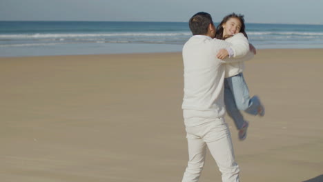 japanese father and child spending time on the beach