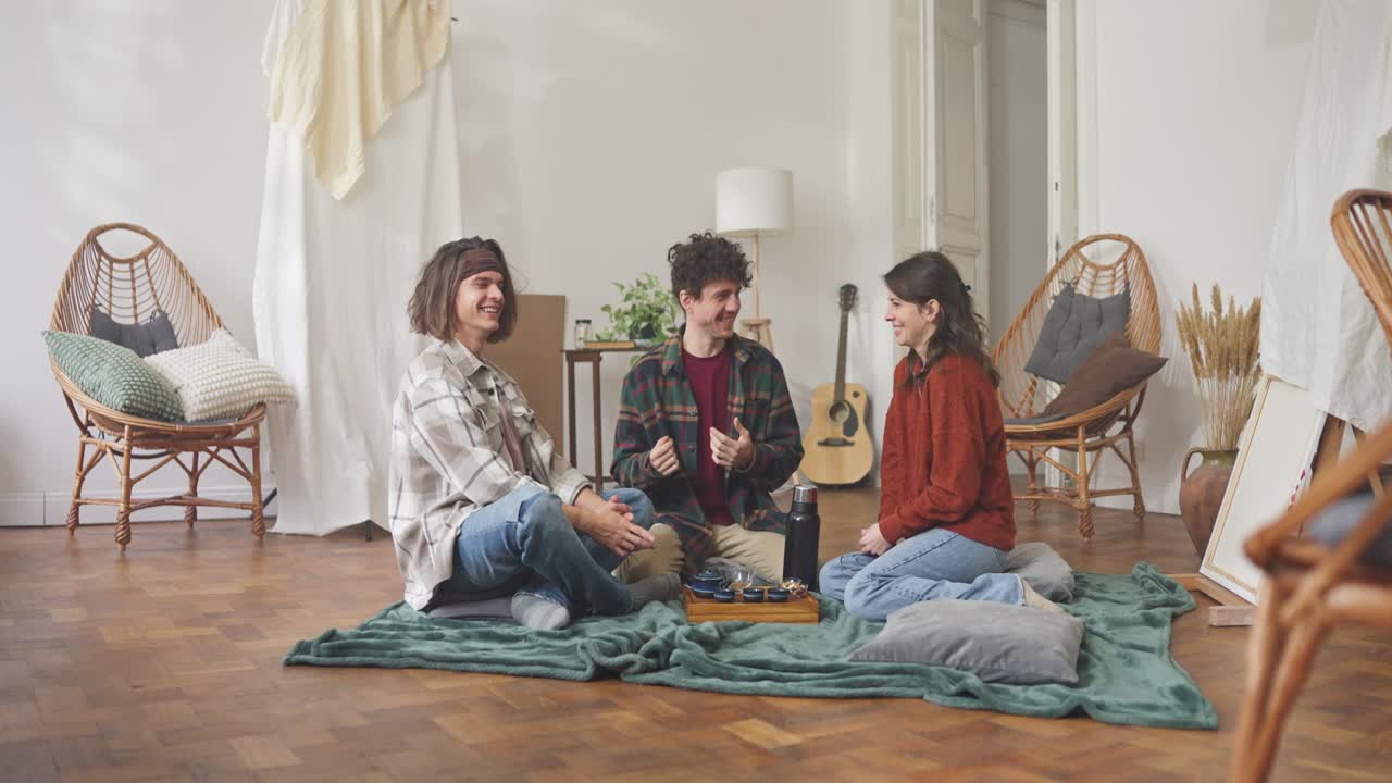 Friends Enjoying Tea in a Cozy Living Room