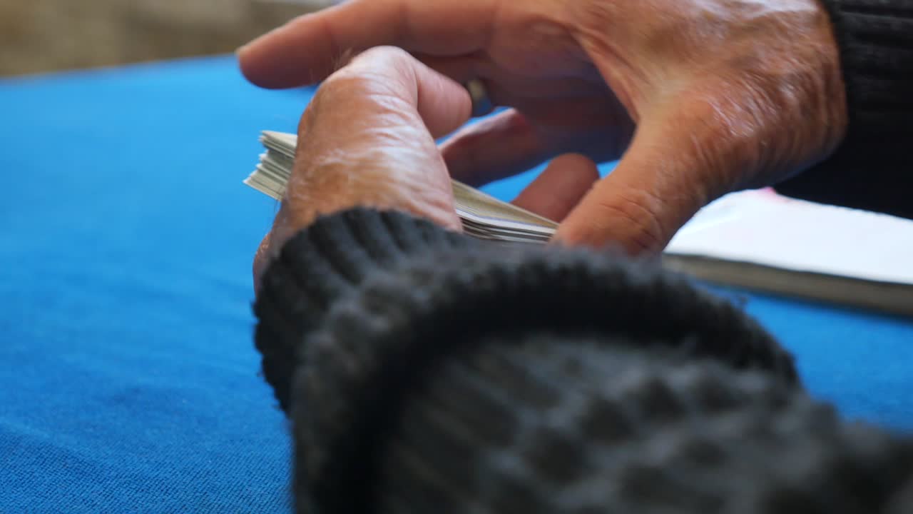 Elderly Hands Playing Cards