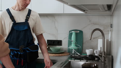 woman talking with plumber