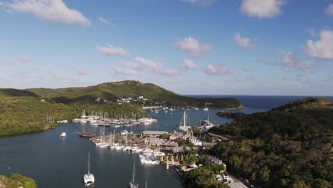 english harbor with yachts and boats docked in scenic nelson’s dockyard antigua under a blue sky