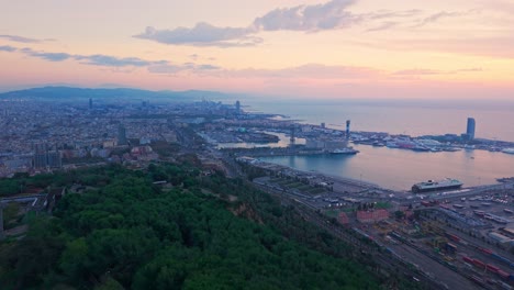 aerial view of barcelona with residential neighborhoods and city harbor, wide establisher