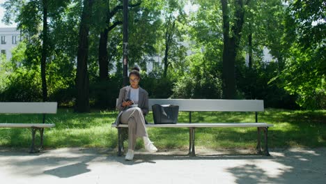 woman using smartphone in a park